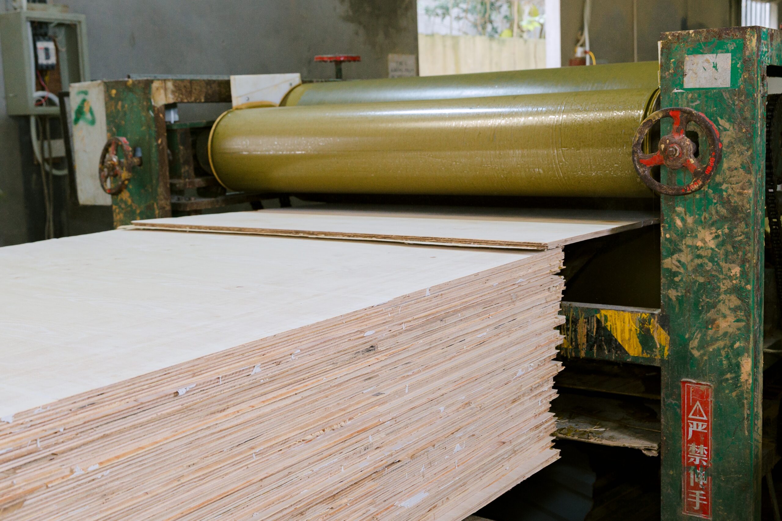 Finished phenolic birch plywood panels stacked at Kosmex Vietnam manufacturing facility